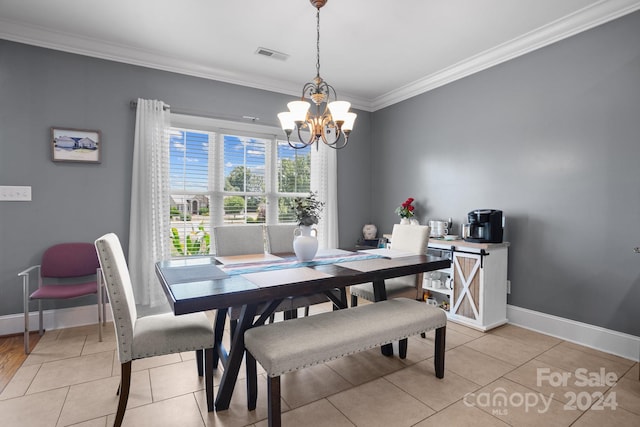 dining space with a chandelier, light tile patterned floors, and crown molding