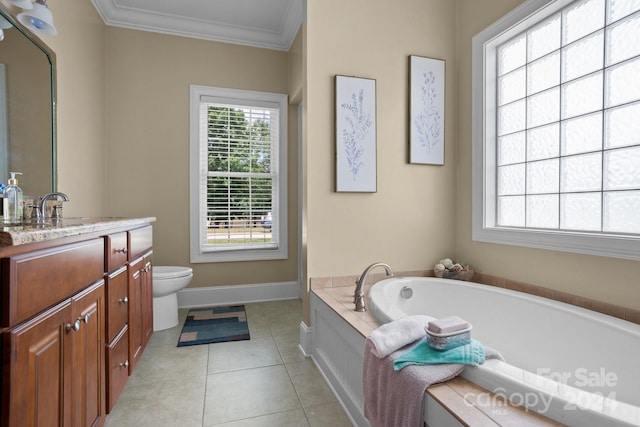 bathroom featuring tile patterned floors, vanity, crown molding, toilet, and a bathing tub