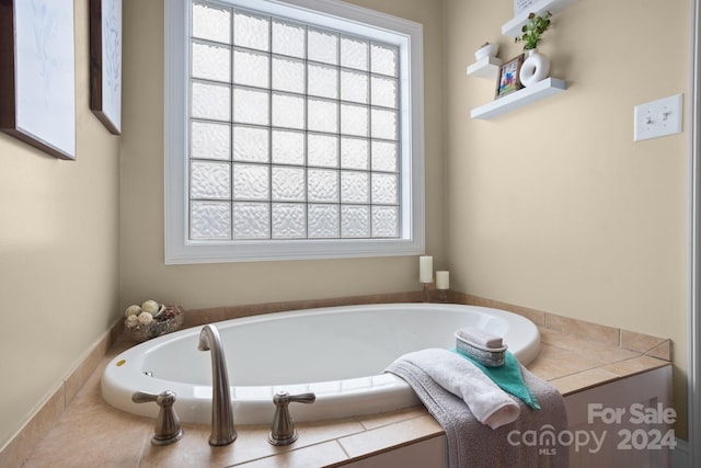 bathroom featuring a tub to relax in