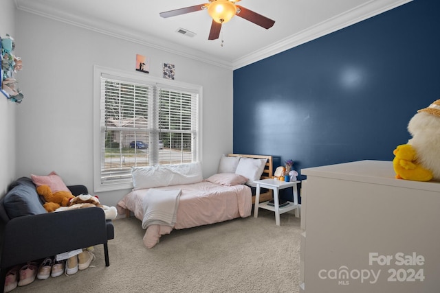 bedroom with light colored carpet, ceiling fan, and crown molding