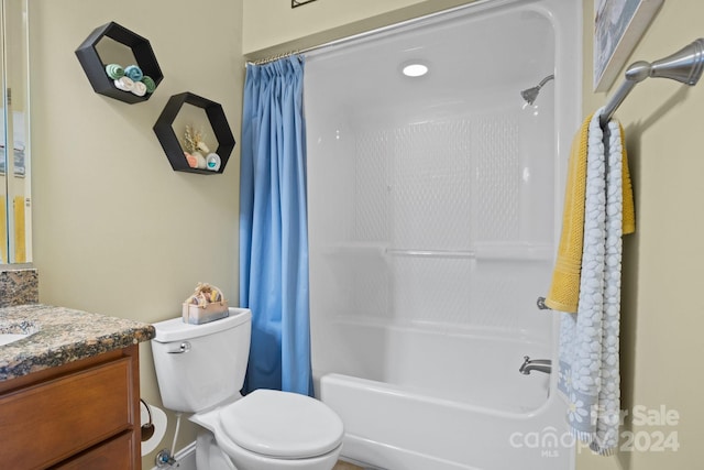 full bathroom featuring vanity, toilet, and shower / bathtub combination with curtain