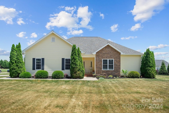 ranch-style house featuring a front lawn