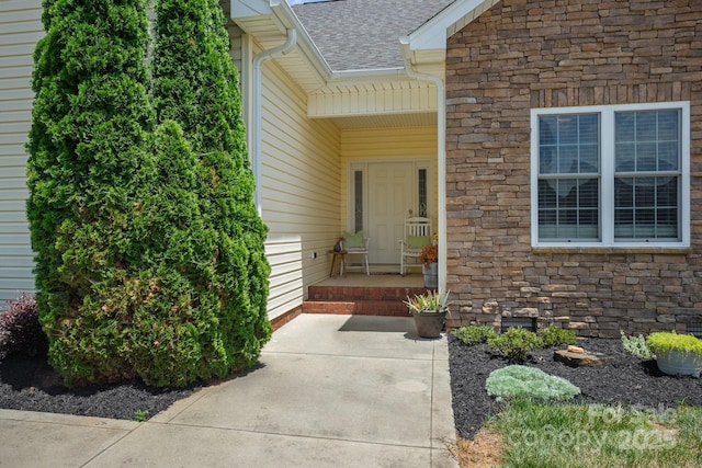 104 Castle Pines Ln, Statesville, NC 28625 - property entrance featuring stone siding and a shingled roof