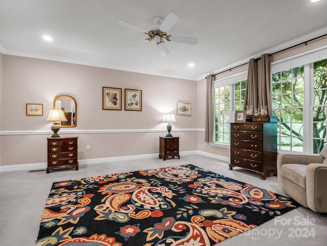 interior space featuring ceiling fan, light colored carpet, and ornamental molding