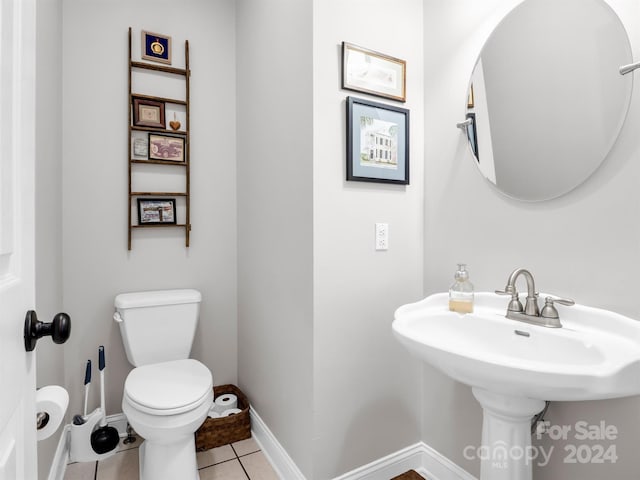 bathroom featuring toilet and tile patterned floors