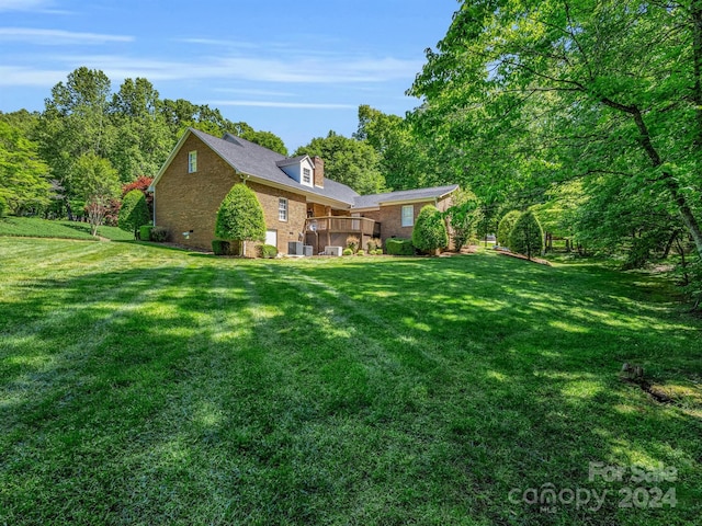 view of yard featuring a wooden deck