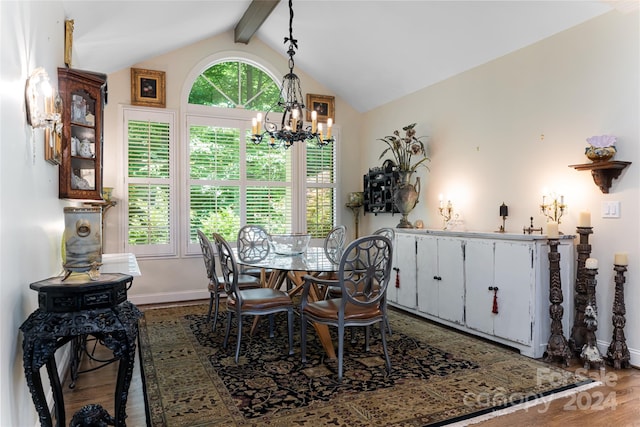 dining area featuring hardwood / wood-style flooring, vaulted ceiling with beams, and an inviting chandelier