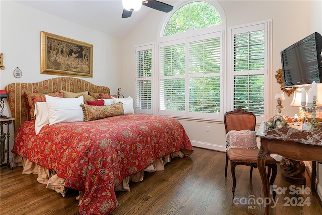 bedroom with multiple windows, dark hardwood / wood-style flooring, and ceiling fan