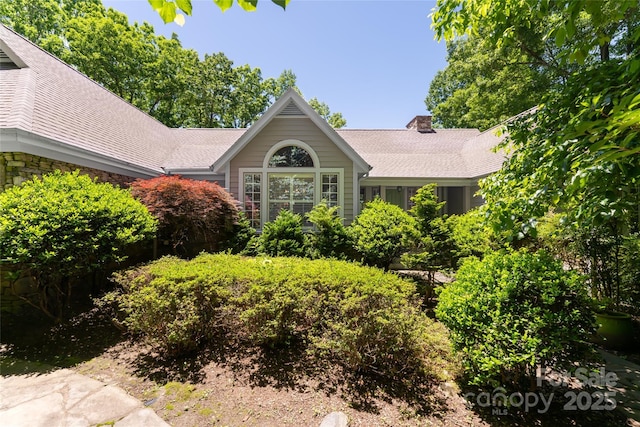 57 Old Hickory Trl, Hendersonville, NC 28739 - view of front facade with a chimney and a shingled roof