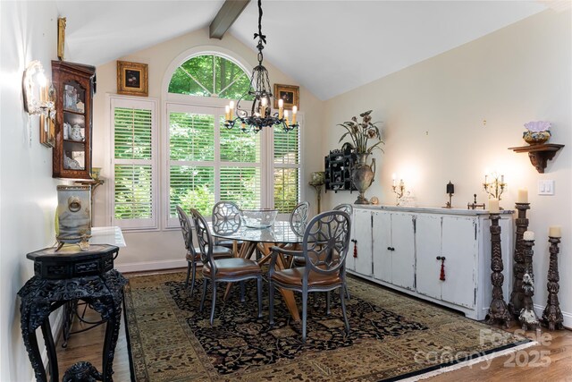 57 Old Hickory Trl, Hendersonville, NC 28739 - dining area featuring a chandelier, wood finished floors, and baseboards