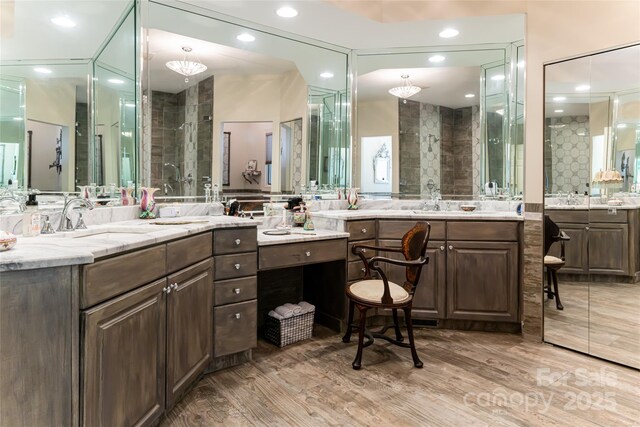 57 Old Hickory Trl, Hendersonville, NC 28739 - bathroom featuring a stall shower, vanity, wood finished floors, and recessed lighting