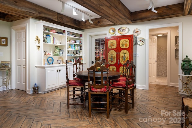 57 Old Hickory Trl, Hendersonville, NC 28739 - dining area featuring track lighting, baseboards, and beam ceiling
