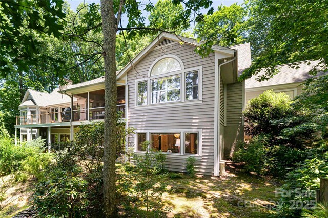 57 Old Hickory Trl, Hendersonville, NC 28739 - back of property featuring a sunroom and an attached garage