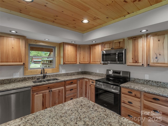 kitchen featuring wooden ceiling, a sink, appliances with stainless steel finishes, recessed lighting, and light stone counters