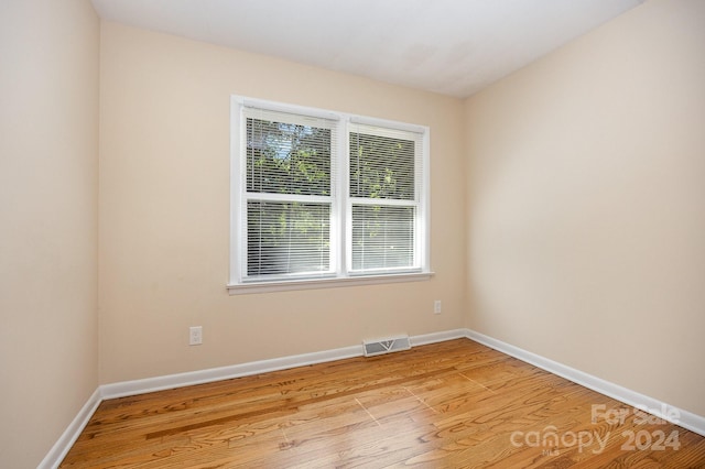 unfurnished room featuring light wood-type flooring