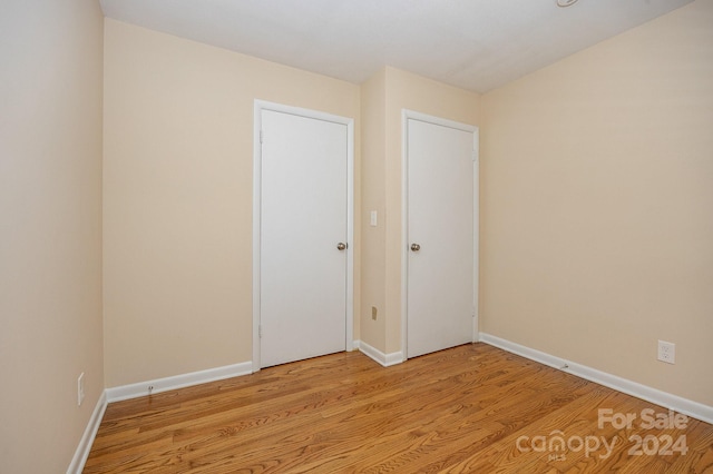 spare room featuring light hardwood / wood-style floors