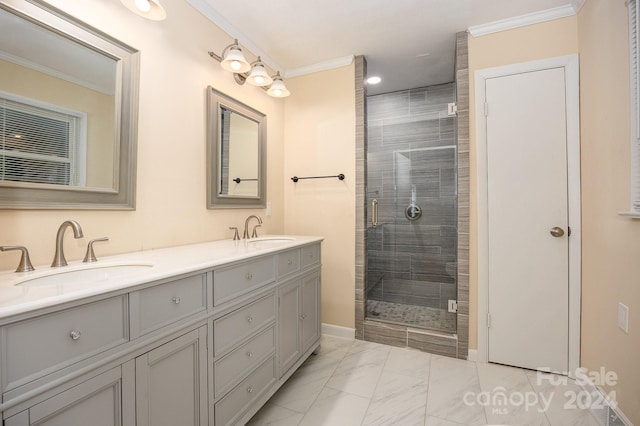 bathroom with a shower with shower door, vanity, and ornamental molding