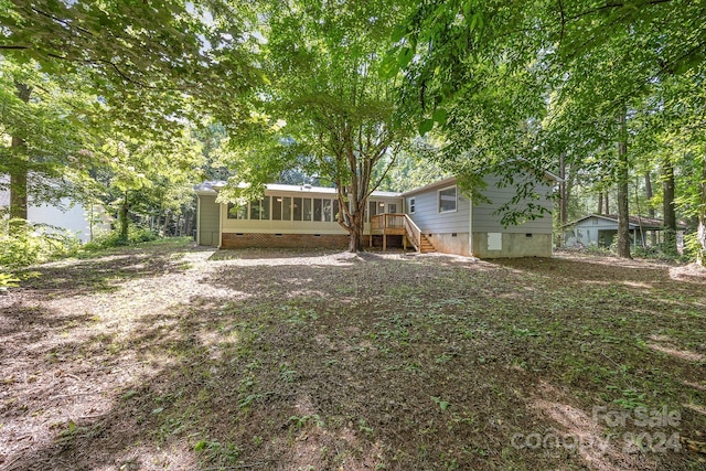 view of yard with a sunroom