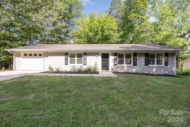 single story home featuring a front yard and a garage