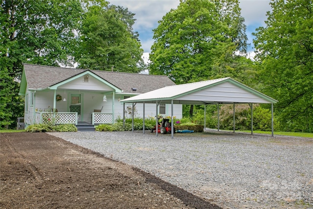 view of front of home with a porch and a carport