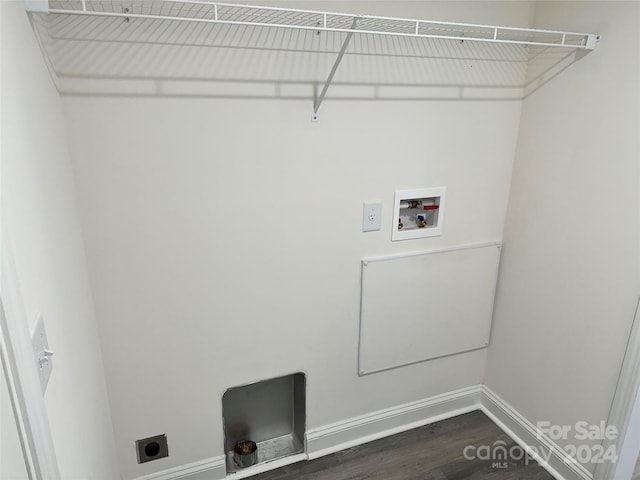 washroom featuring laundry area, baseboards, dark wood finished floors, hookup for an electric dryer, and washer hookup