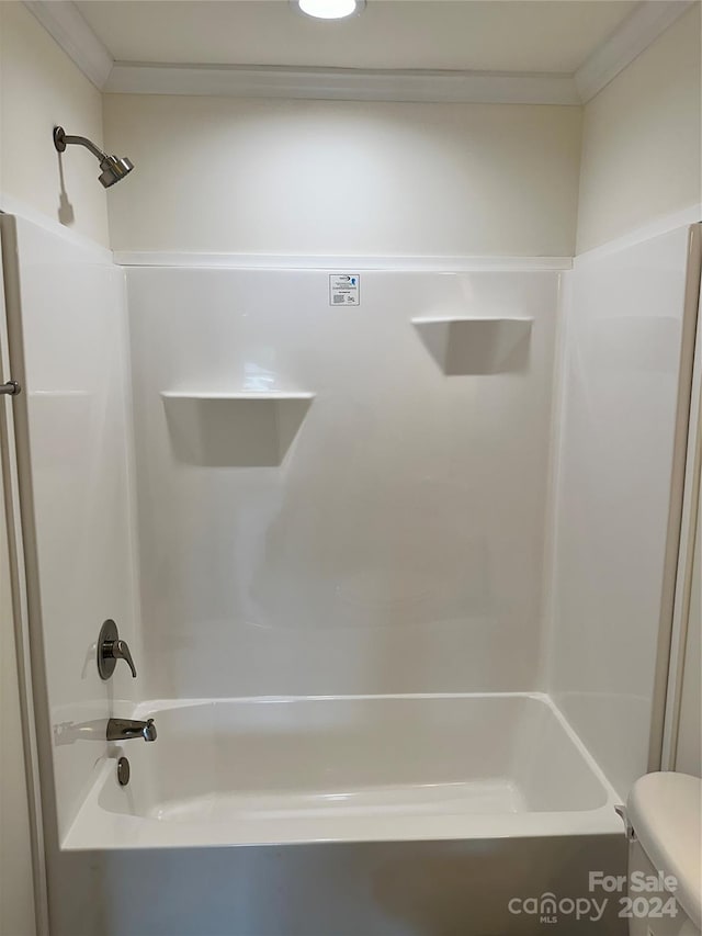 full bathroom featuring ornamental molding, toilet, and shower / bathing tub combination