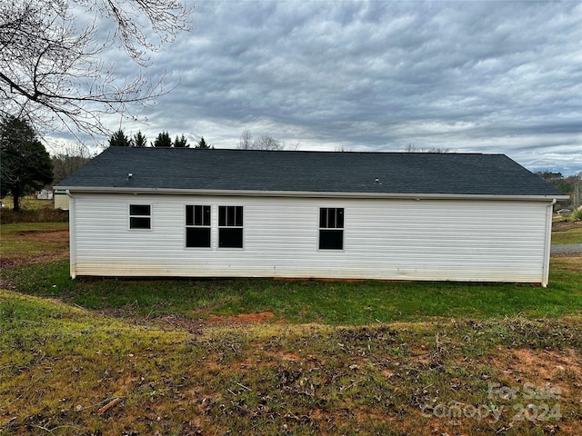 rear view of house with a lawn