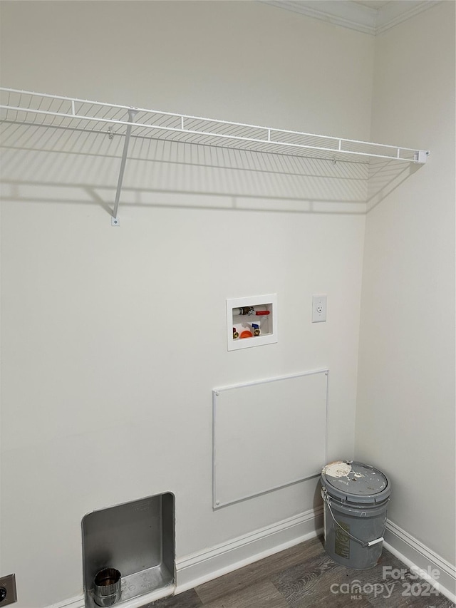 laundry area featuring crown molding, washer hookup, and dark hardwood / wood-style floors