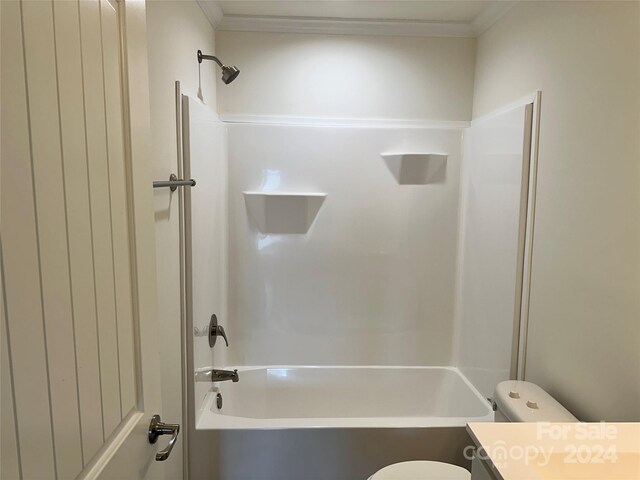 full bathroom with tub / shower combination, vanity, toilet, and crown molding