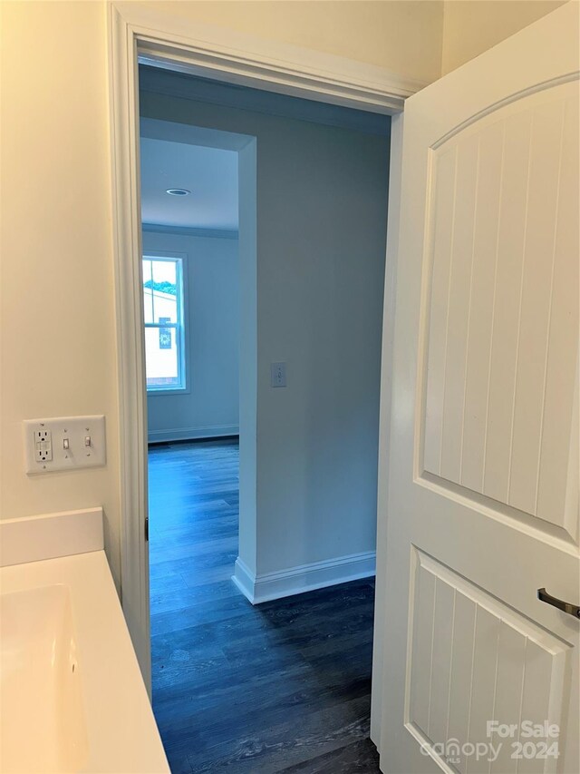 hallway featuring dark hardwood / wood-style floors