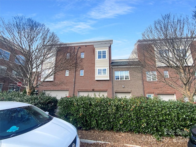 view of building exterior featuring a garage