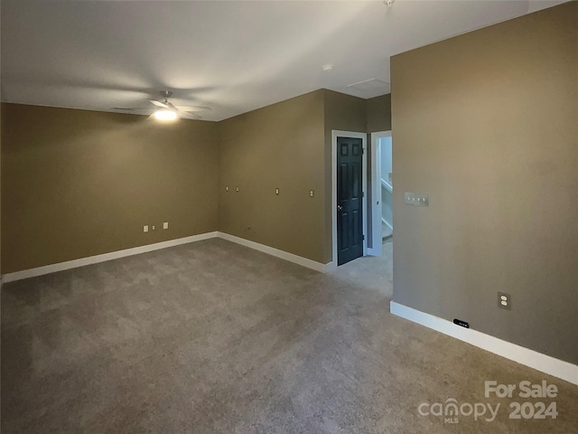 carpeted empty room featuring ceiling fan