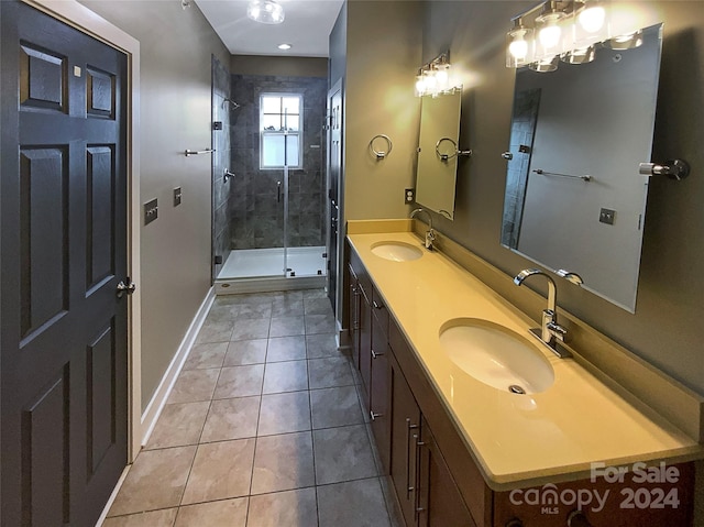 bathroom featuring vanity, tile patterned floors, and walk in shower