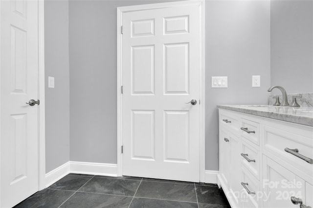 bathroom with vanity and tile patterned flooring