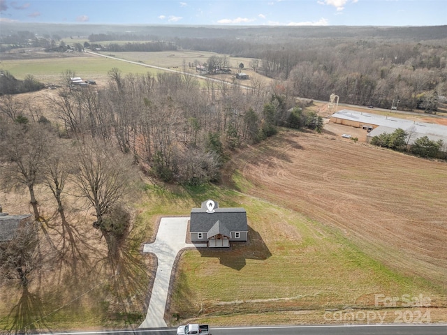 birds eye view of property featuring a rural view