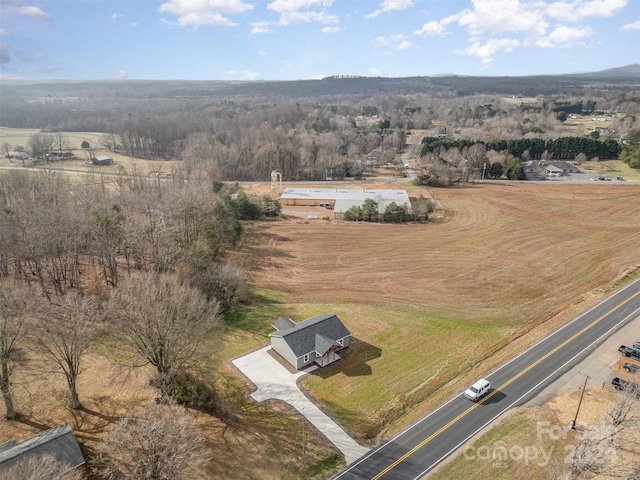 birds eye view of property featuring a rural view