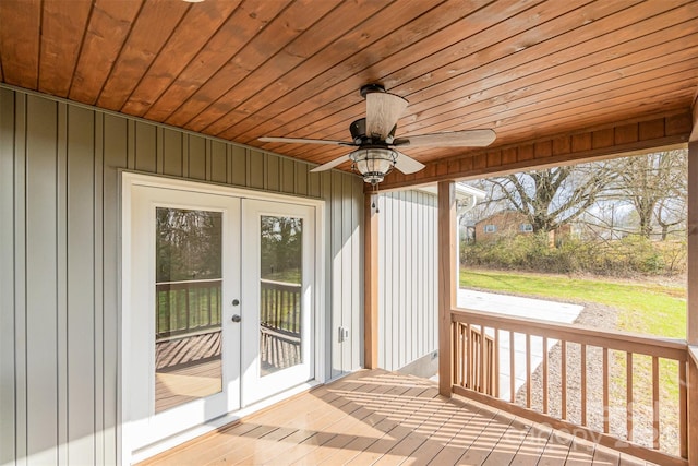 unfurnished sunroom with french doors, ceiling fan, and wooden ceiling