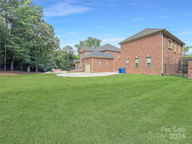 view of yard featuring a garage