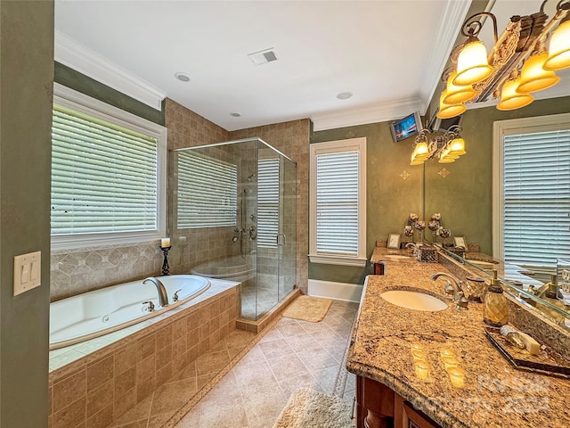 bathroom with plenty of natural light, vanity, crown molding, and separate shower and tub