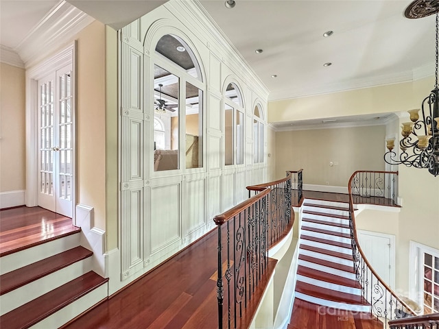 hall featuring ornamental molding and dark hardwood / wood-style floors