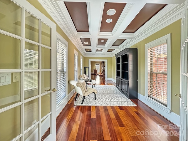 unfurnished room featuring beam ceiling, a healthy amount of sunlight, crown molding, and coffered ceiling