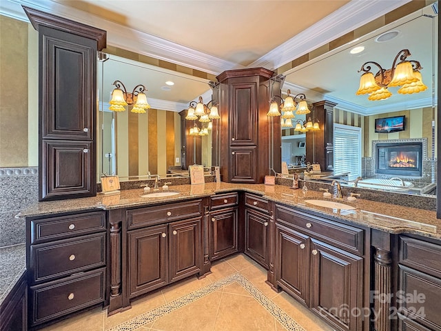 bathroom featuring vanity, tile patterned floors, decorative columns, and crown molding