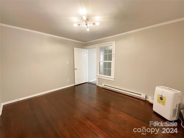 unfurnished room with a baseboard radiator, dark hardwood / wood-style floors, crown molding, and an inviting chandelier