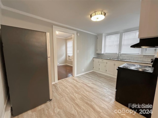 kitchen with black electric range oven, white cabinetry, sink, ornamental molding, and backsplash