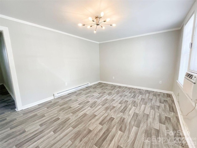 unfurnished room featuring a wealth of natural light, a baseboard heating unit, a notable chandelier, light hardwood / wood-style flooring, and crown molding