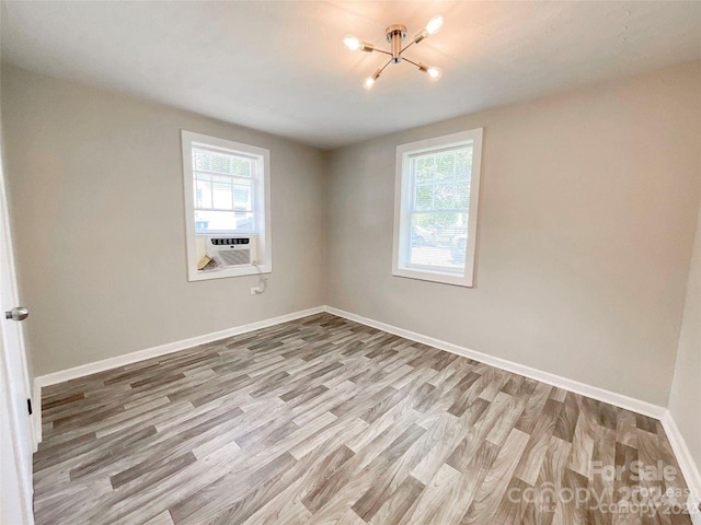 empty room featuring light hardwood / wood-style flooring and cooling unit