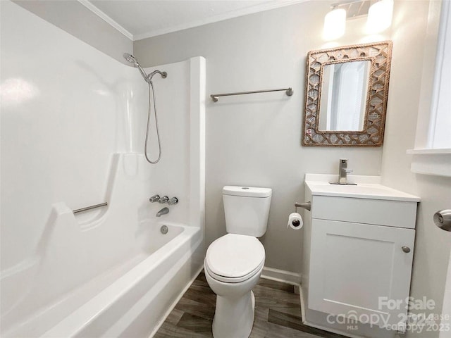 full bathroom with toilet, hardwood / wood-style floors, crown molding, bathing tub / shower combination, and vanity