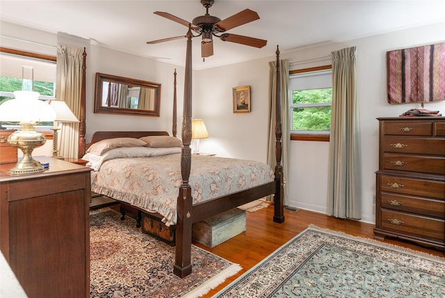 bedroom with ornamental molding, ceiling fan, and hardwood / wood-style floors