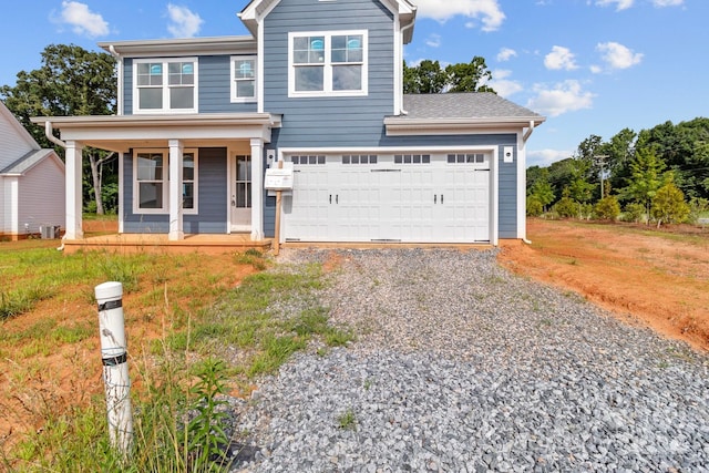 view of front of home with a garage and a porch