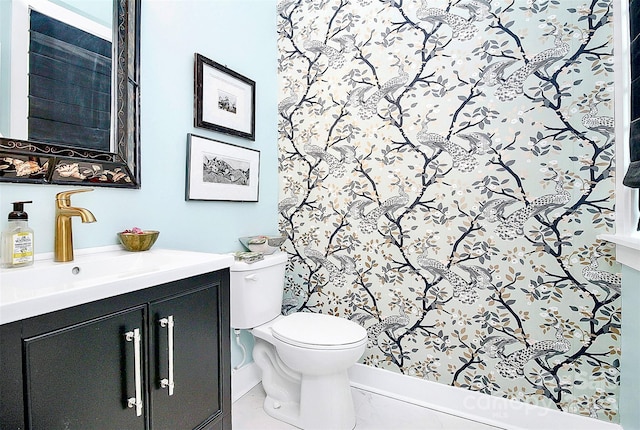 bathroom with vanity and toilet